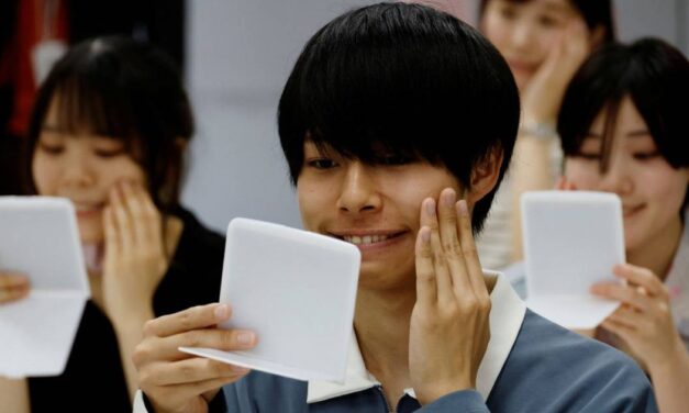 People in Japan who got used to face masks during COVID are attending smiling lessons