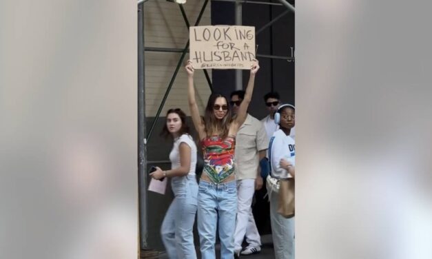 New York woman walks down the street with a ‘looking-for-a-husband’ sign — sparking plenty of conversation