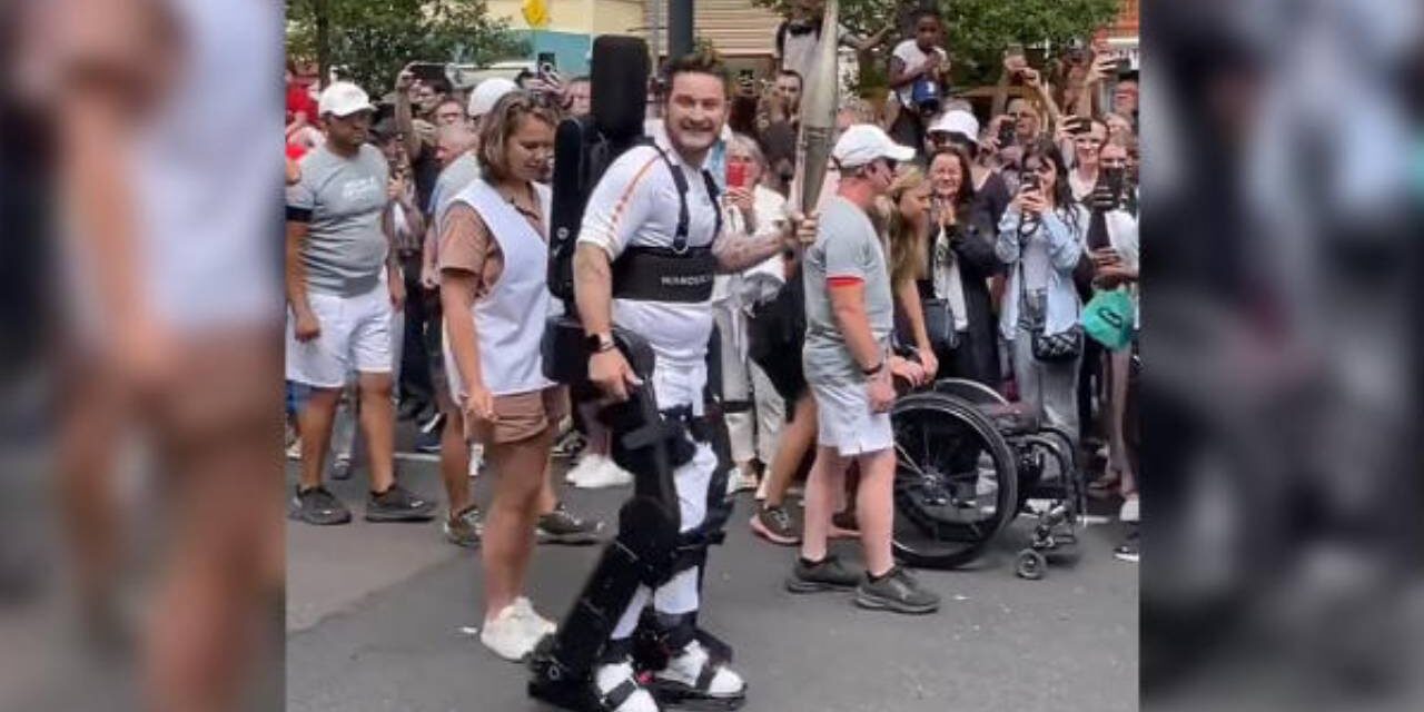 PARALYZED TENNIS PLAYER CARRIES OLYMPIC TORCH USING ROBOTIC EXOSKELETON