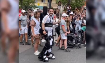 PARALYZED TENNIS PLAYER CARRIES OLYMPIC TORCH USING ROBOTIC EXOSKELETON