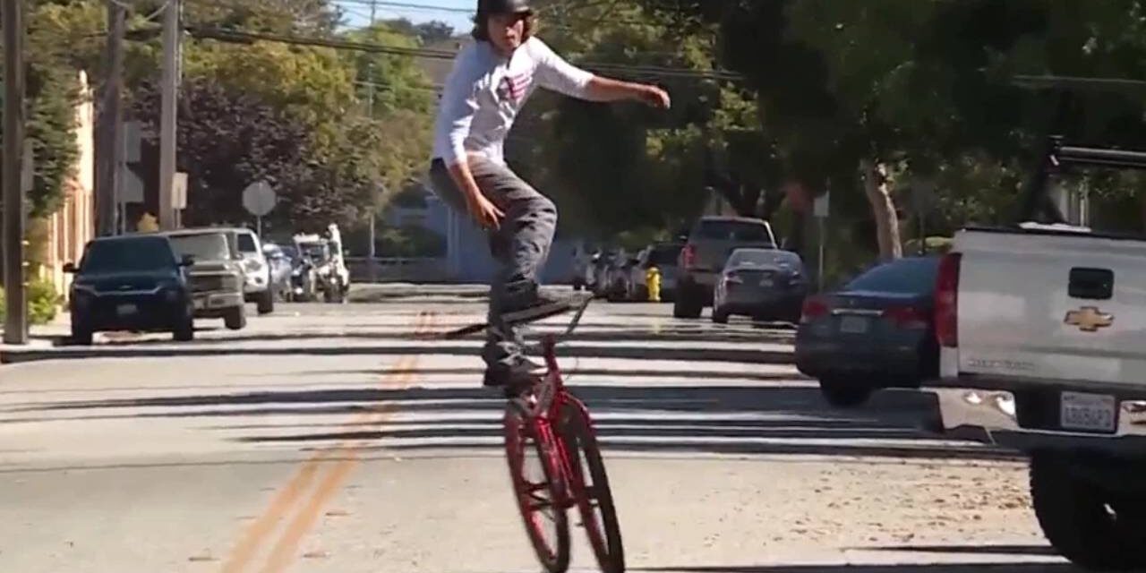 Stunt rider unofficially breaks ‘bike surfing’ world record