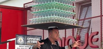 Cypriot balances 511 wine glasses on his head