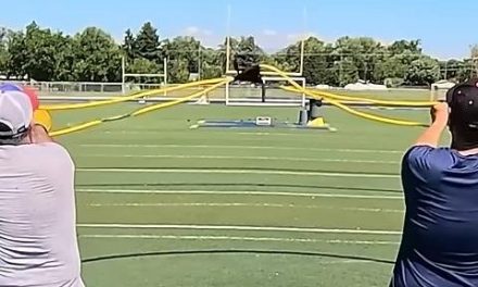 Trio of men use slingshot to make cornhole shot from 151 feet