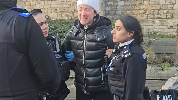 Shocking moment woman is arrested and fined for feeding pigeons