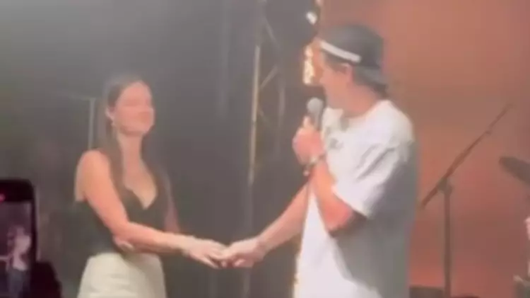 Band left mortified after public proposal at their gig goes horribly wrong in viral footage