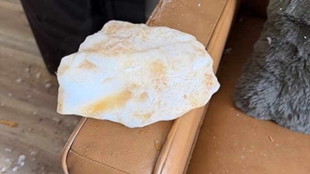 Falling ice chunk crashes through roof, lands on living room couch